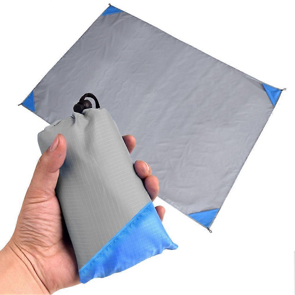 Sand and Water Resistant Lightweight Pocket Camping Tarp, 55" x 60" Foldable and Easy to Put in Small Bags grey blue corner