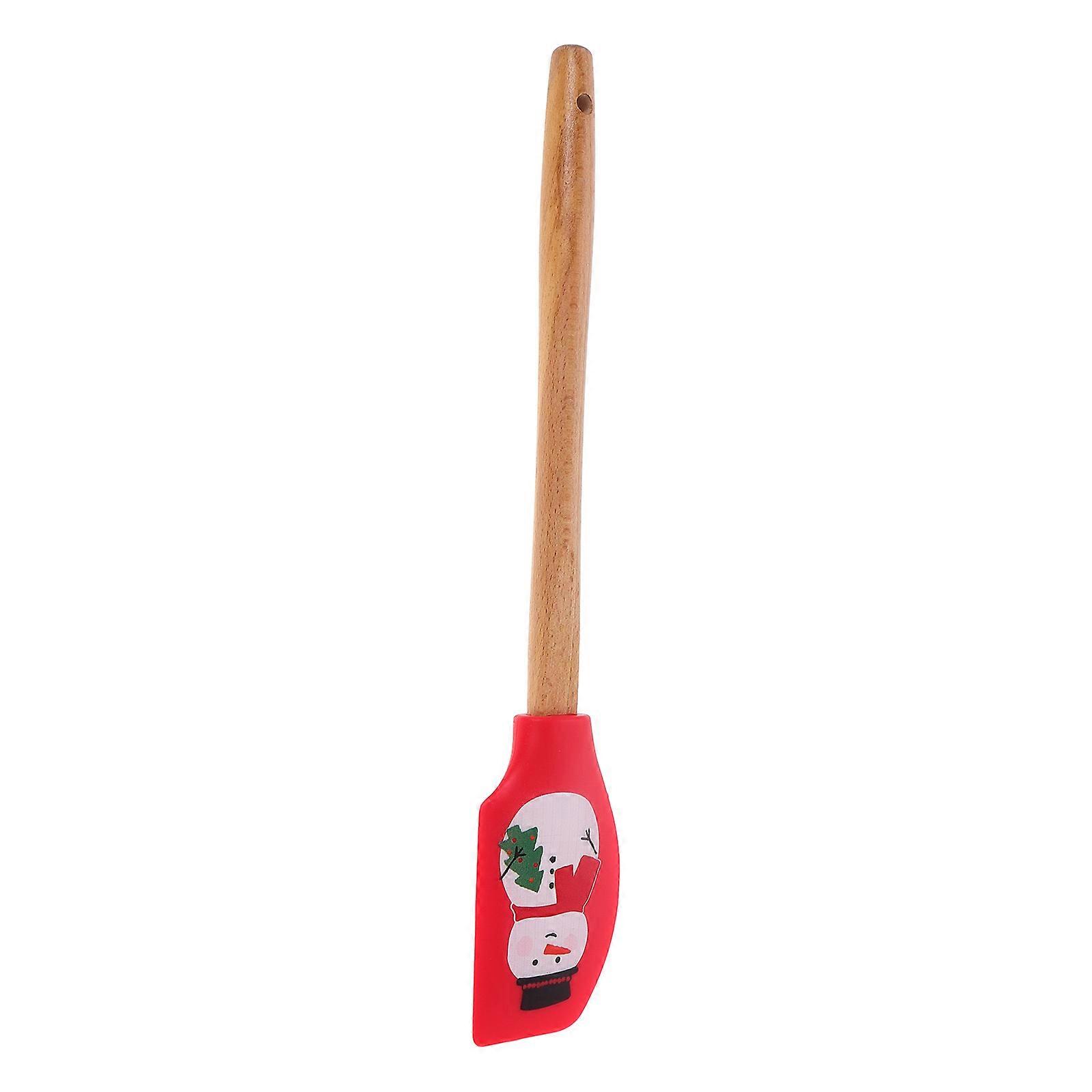 The **Snowman Silicone Jar Spatula with Wooden Handle** is a festive and functional kitchen tool designed for holiday baking and cake decorating.