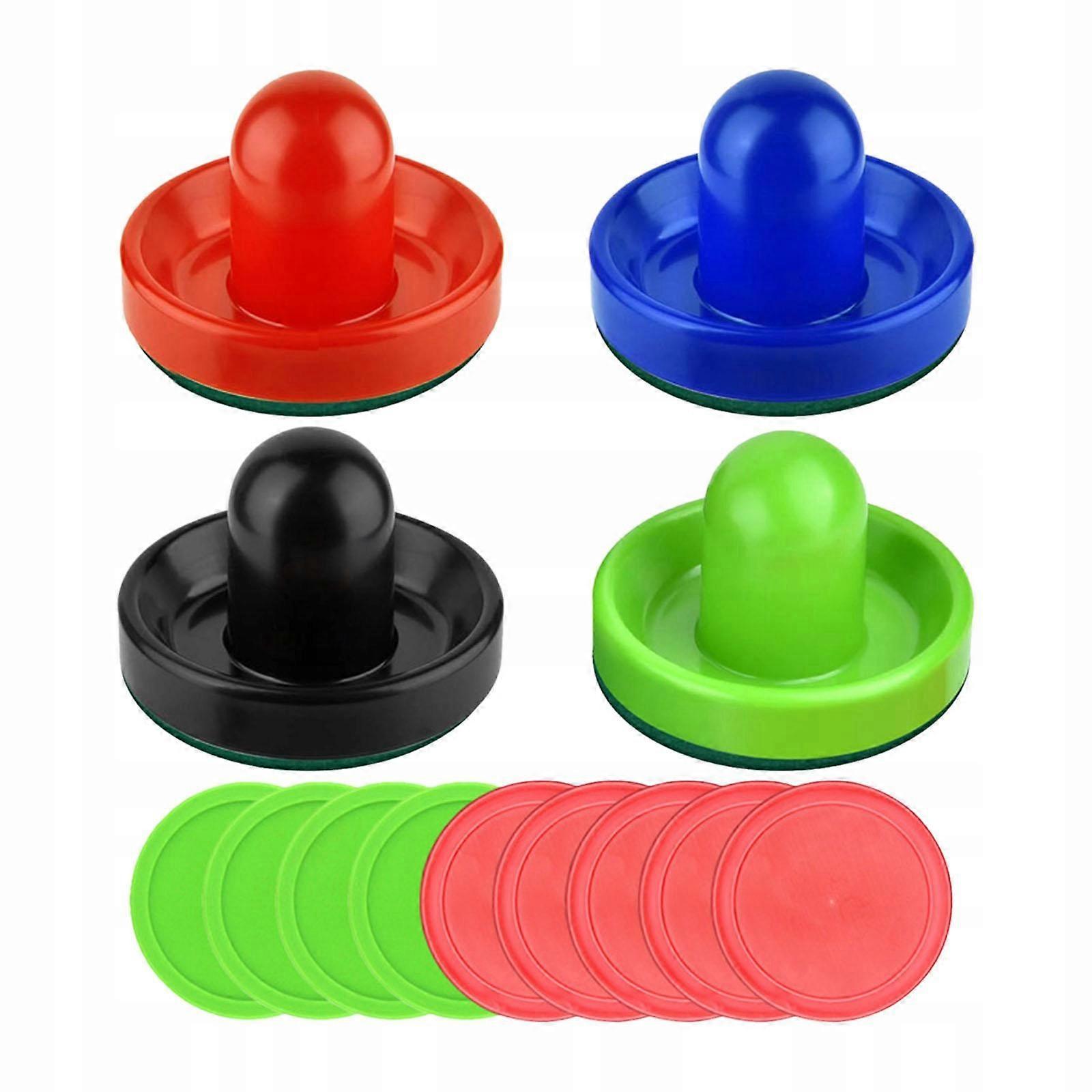 A Set Of 4 Colorful Air Hockey Pushers And 8