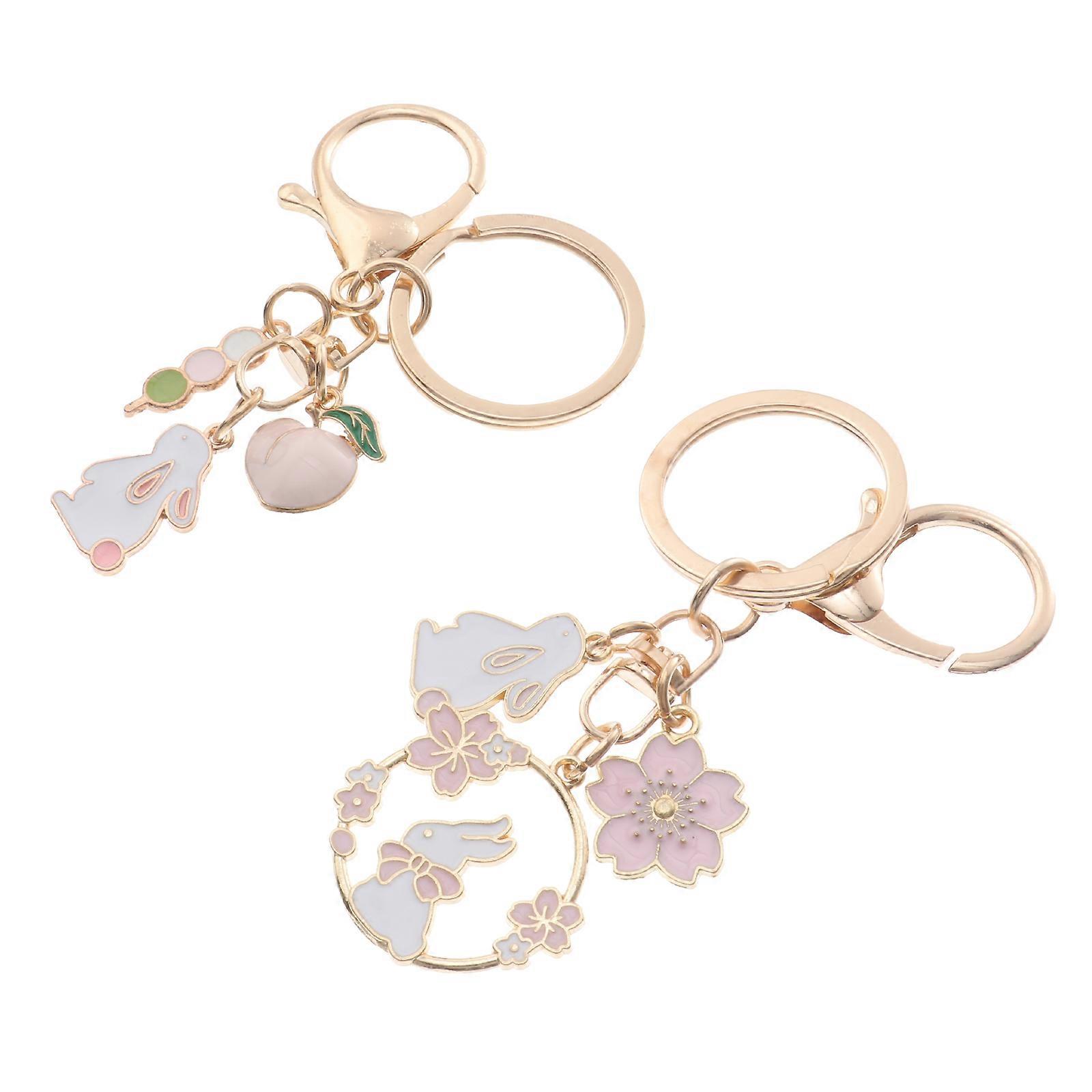 a refined product description for your **2pcs Cute Rabbit Key Holders**:
**2pcs Cute Rabbit Key Holders – Durable Cartoon Keychains for Bags,