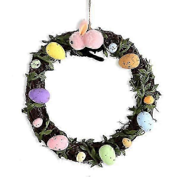 Easter egg wreath with artificial flowers and green leaves for the front door