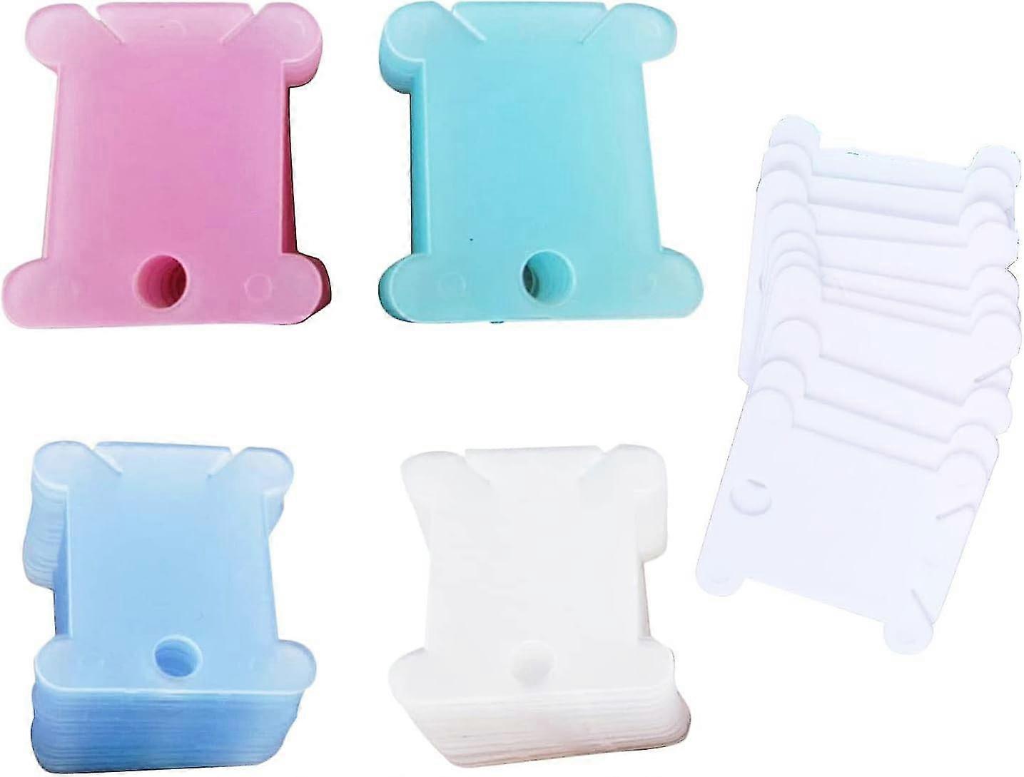 KINZON 100 pcs plastic bobbin shuttle embroidery cross shuttle for sewing machine accessories.