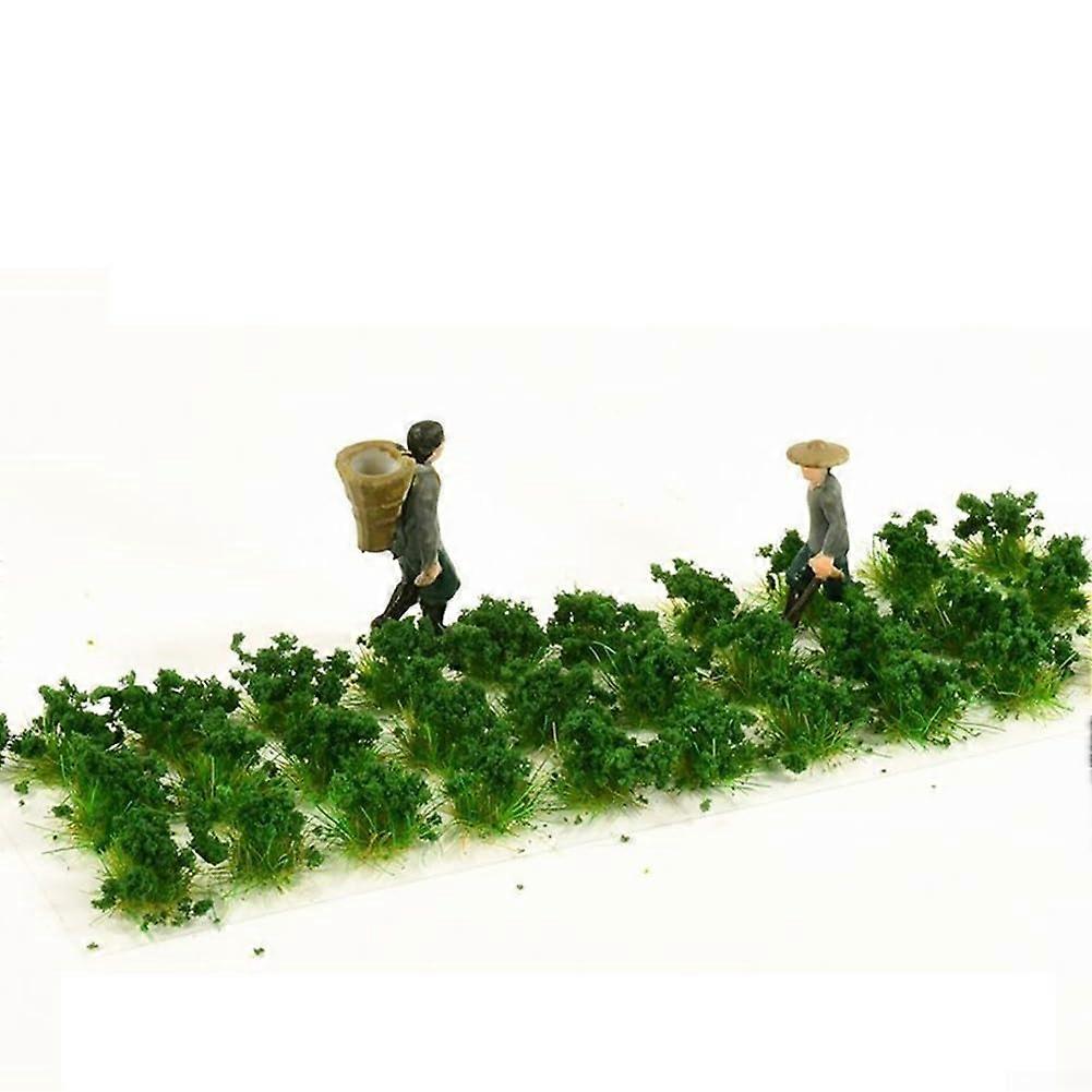 Dynamic miniature landscape with static grass and irregular flower clusters for crafting and model making (deep grass shrub)