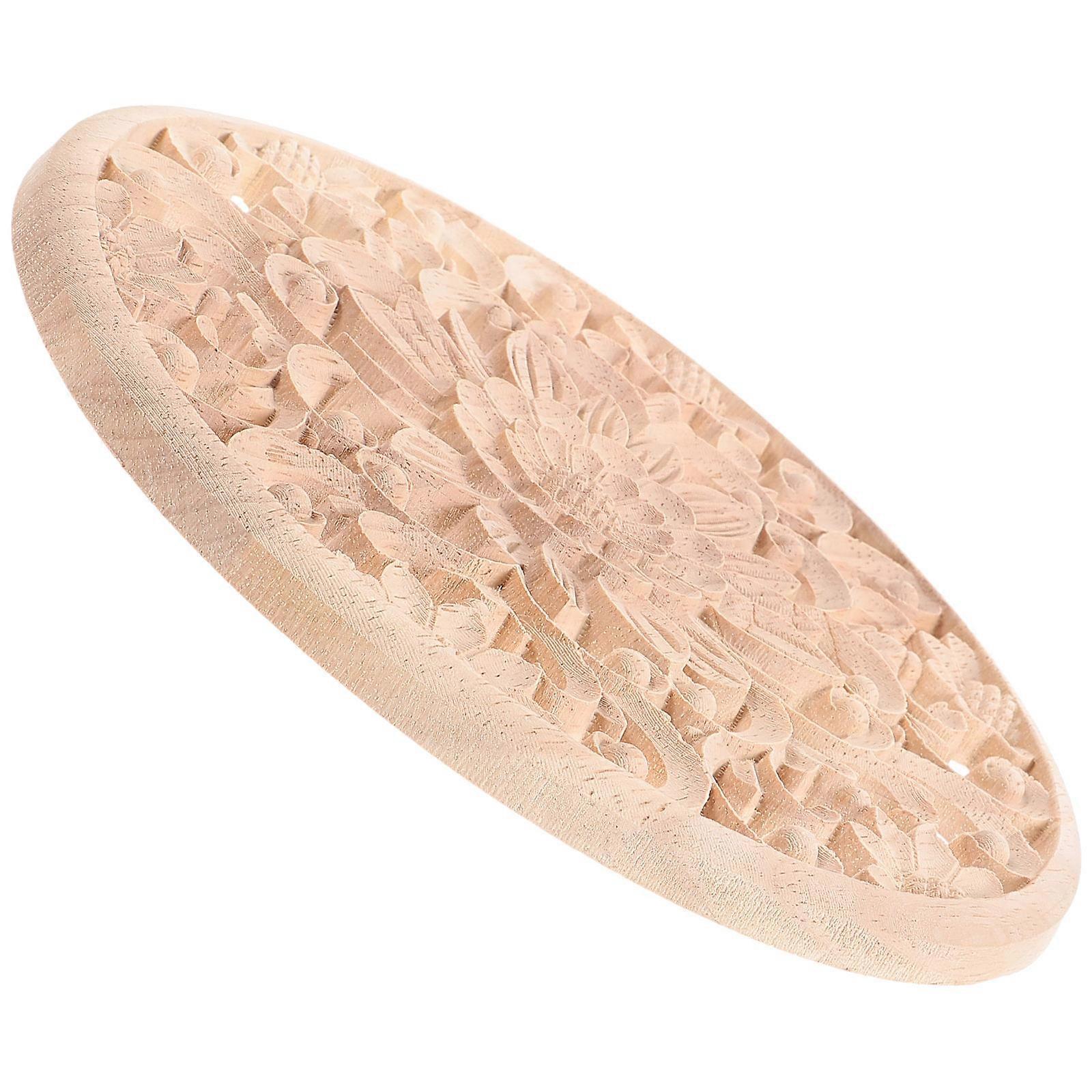 Applique décorative ronde en bois sculpté, faite à la main.