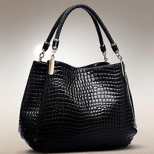 Bolsa feminina elegante e sofisticada com estampa de crocodilo e pedraria.