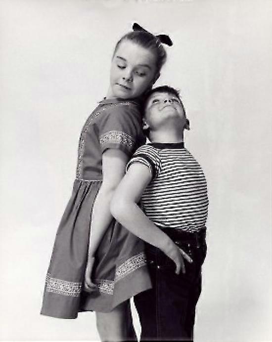 A Brother And His Sister Comparing Their Height Poster