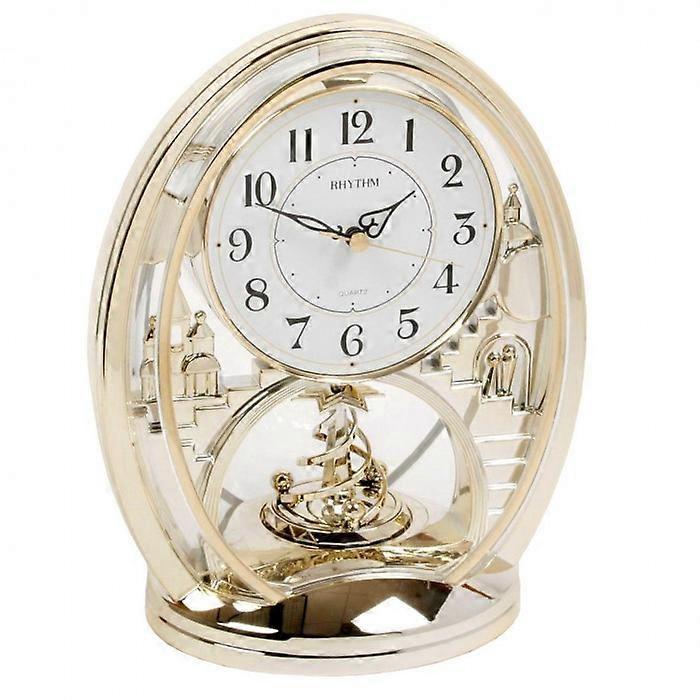 Rhythm Cont Mantel Clk Oval Gilt/Arabic Dial/Rotating Pend