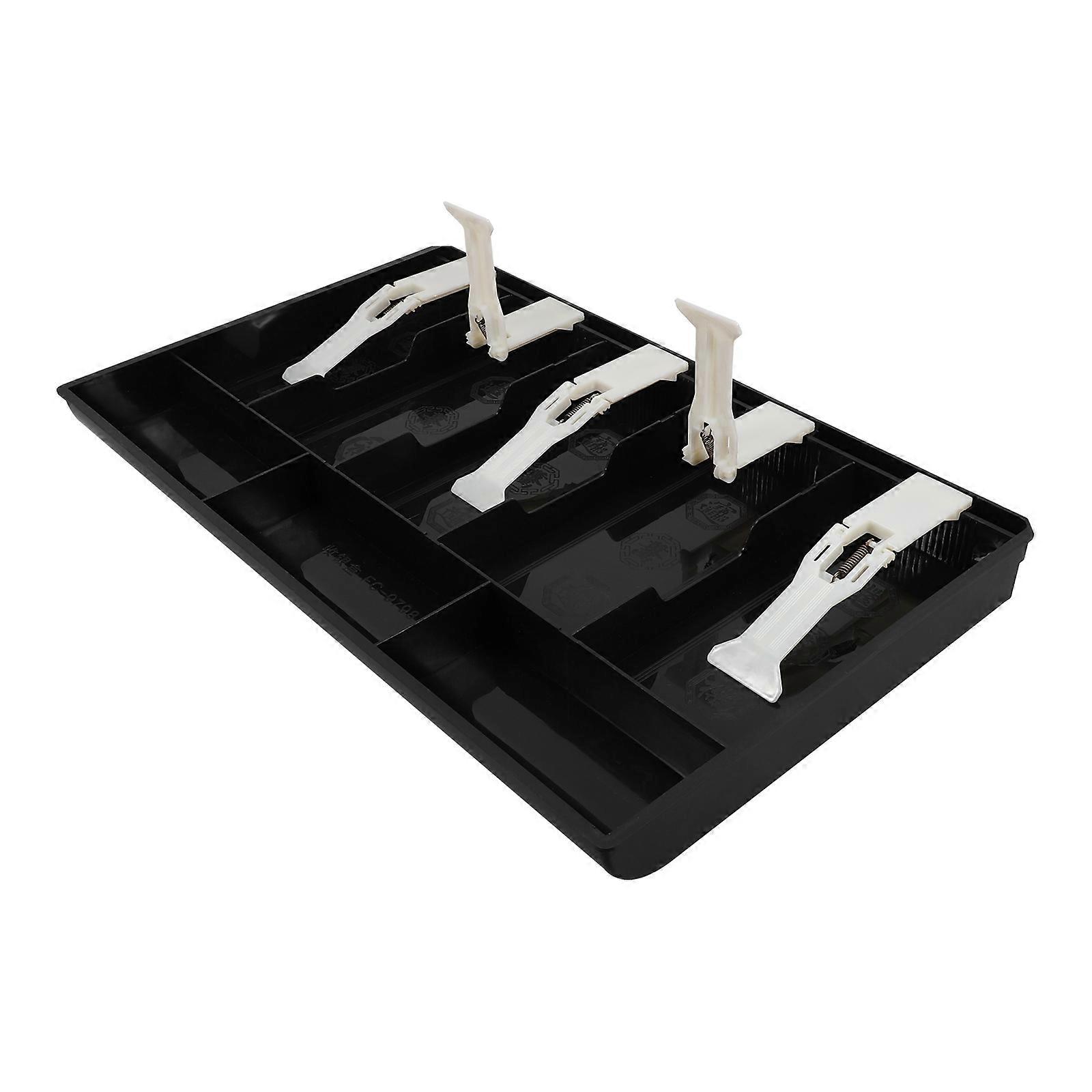 It seems you're referring to a ** drawer tray with plastic clips**, a **sturdy and lightweight cash holder** designed to organize coins and paper