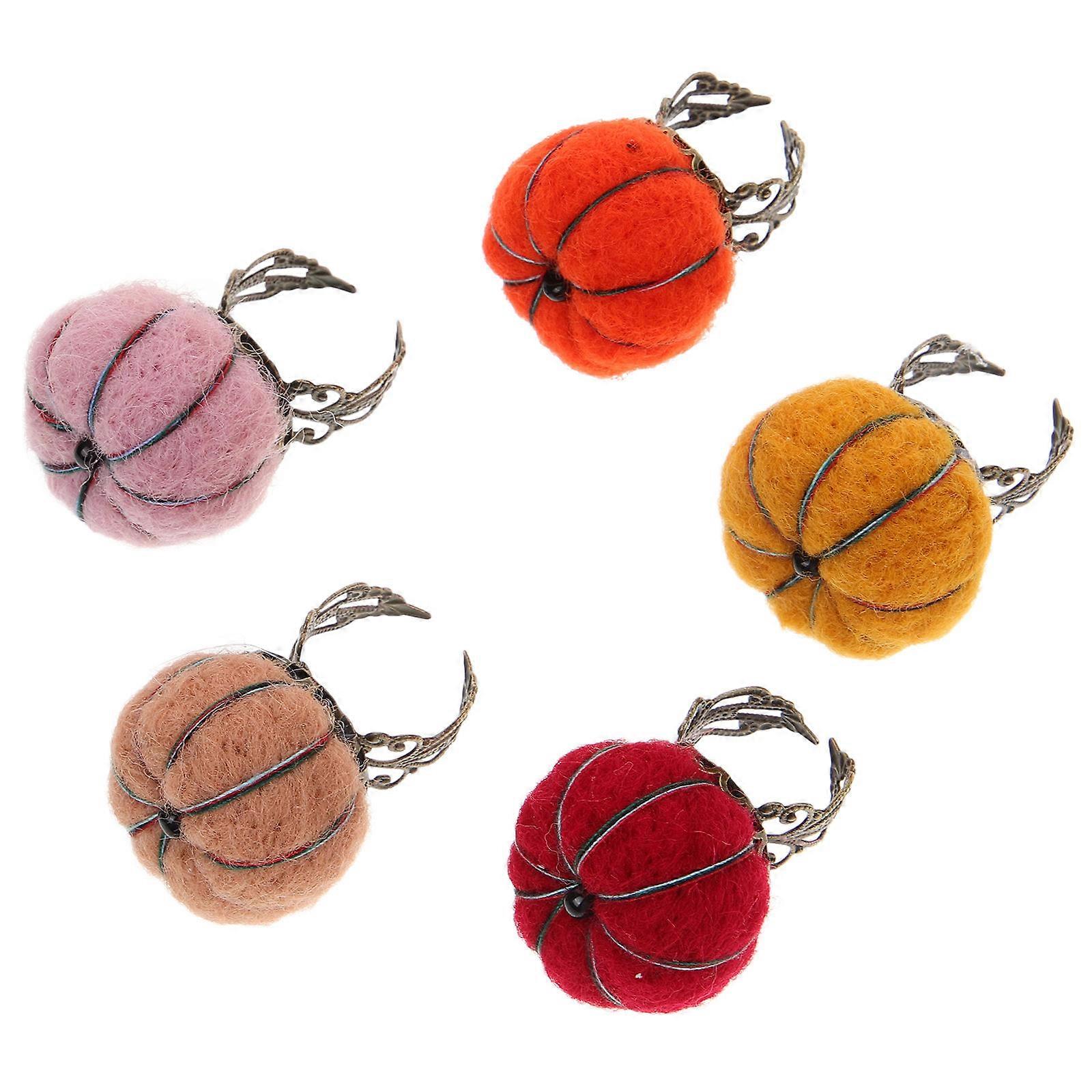 Herramienta de costura con anillo de alfiletero multicolor duradero para un fácil almacenamiento de agujas y uso diario.