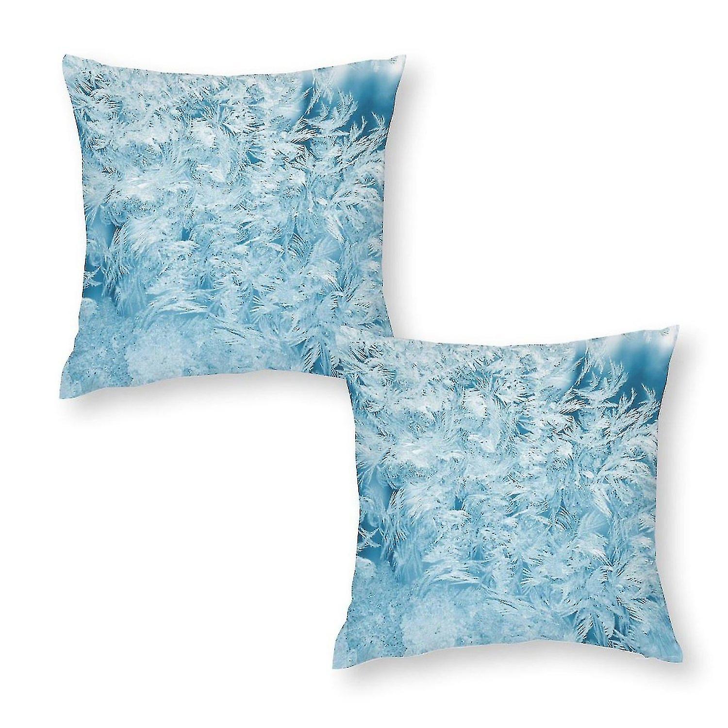 Many white feathers on printed pillowcase on blue background