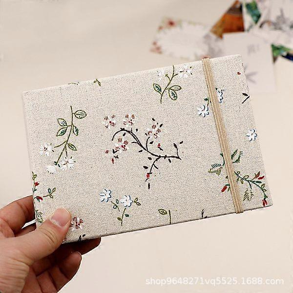 4x6 100-pocket linen photo album, small capacity, easy to classify and portable (colorful flower branches).