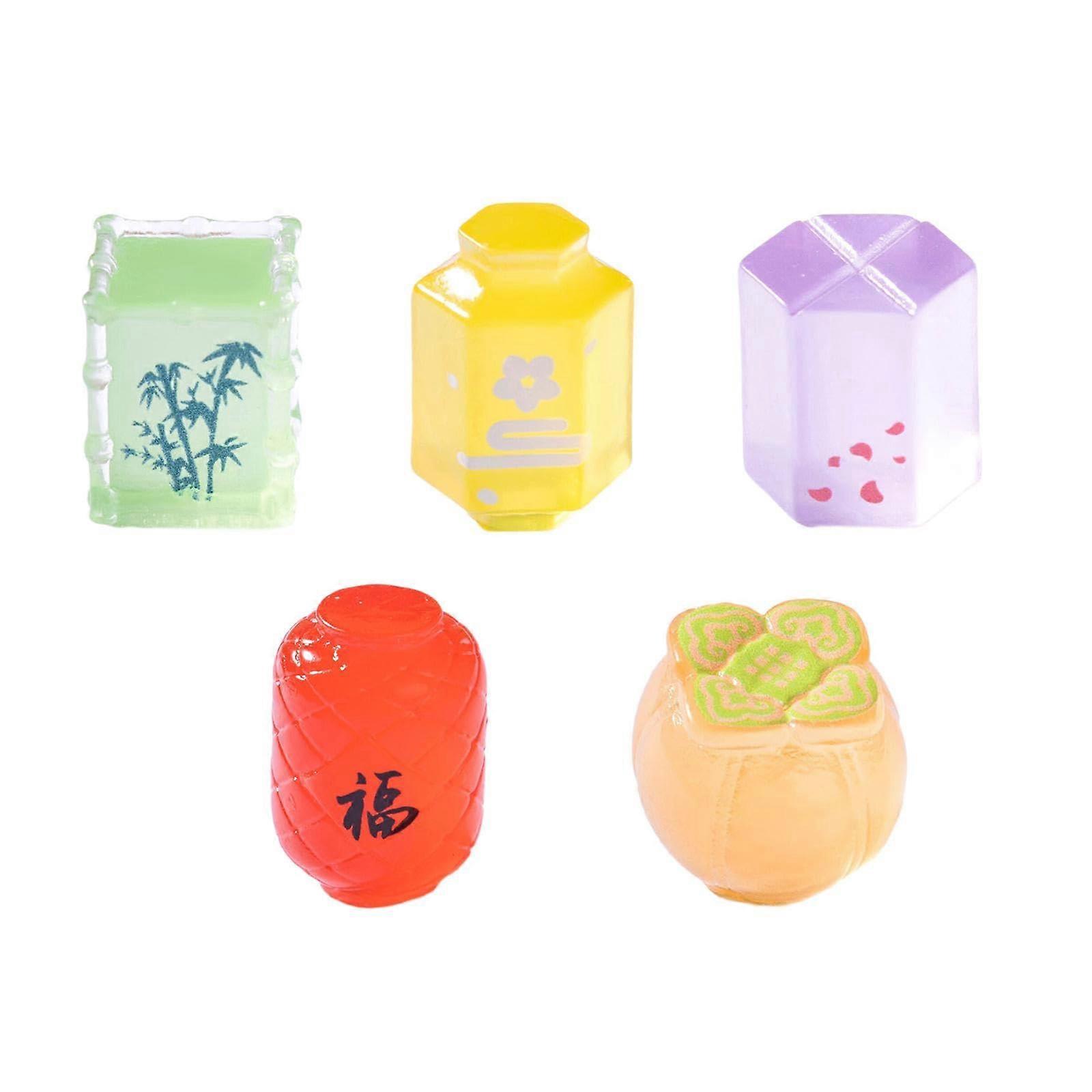 5 pieces of miniature resin light table decorations with glowinthedark effect figures for office and home decor.