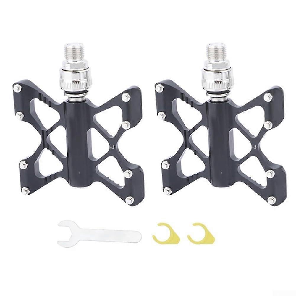 Aluminum alloy bicycle pedal with quickrelease and sturdy tread design for various bikes, black.