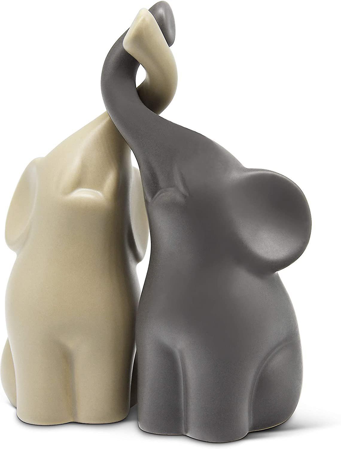Beige ceramic elephant, a meaningful gift.