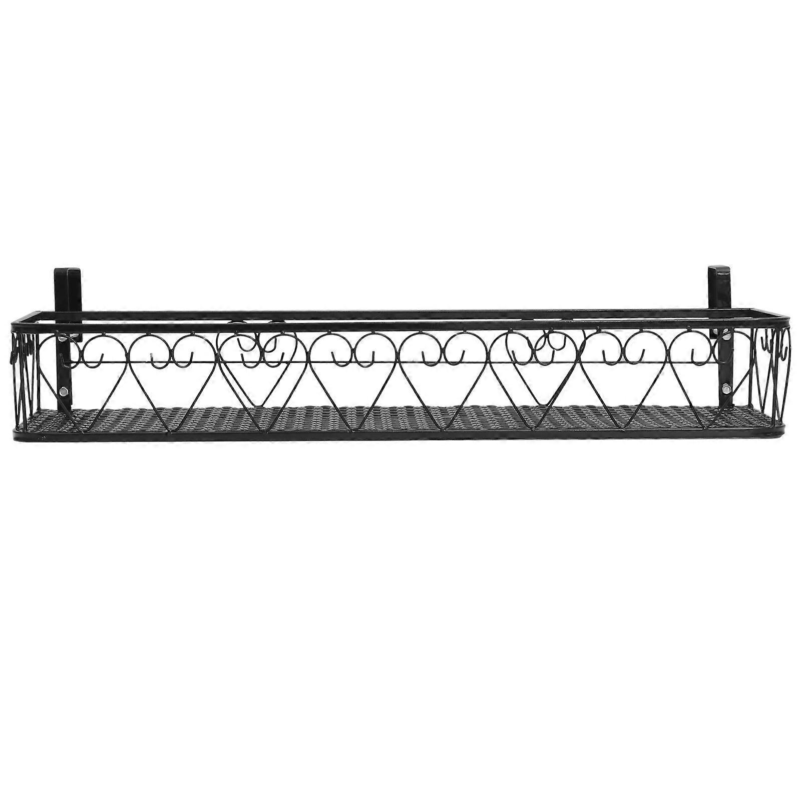 It sounds like you're describing a **black ironwork balcony flower pot holder rack**—a stylish and functional way to display plants on a balcony or