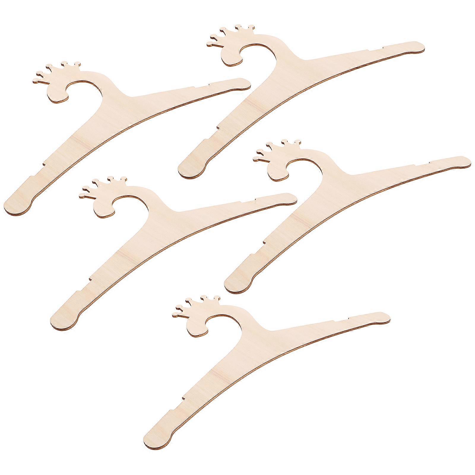 Here's a polished and engaging product description based on the title you provided:
**5pcs Cartoon Crown Wooden Hangers – Princess & Prince