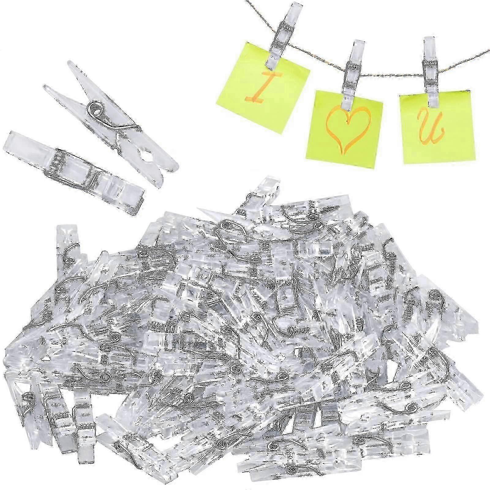 Tiny clear clips for hanging pictures and card paper