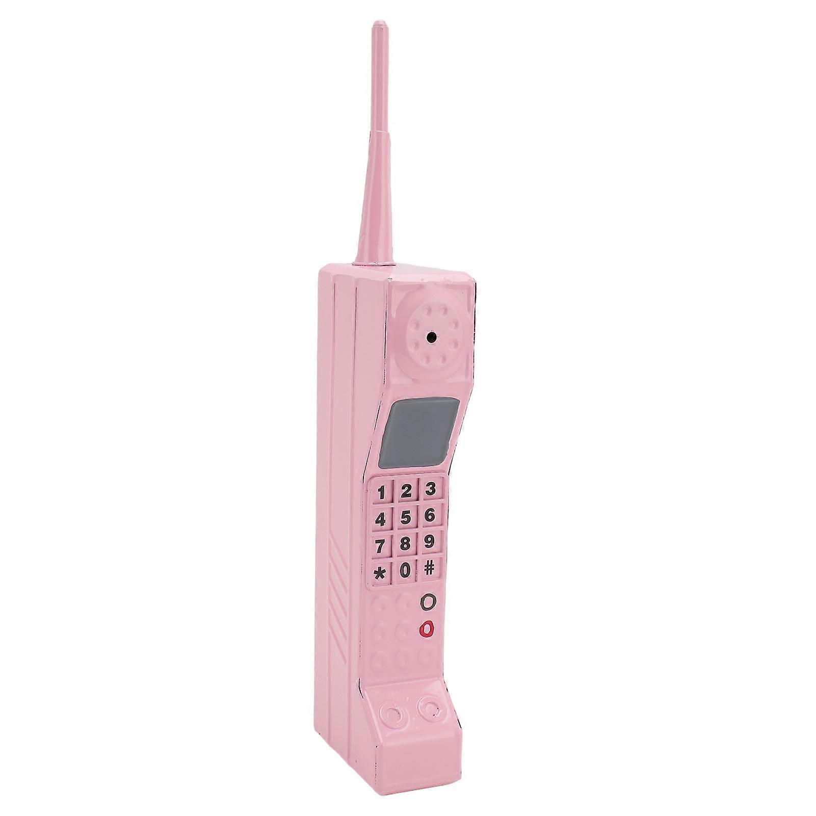 Brick cell phone model, vintage cell phone accessory, old-fashioned simulation, photography props, stylized ornaments, pink