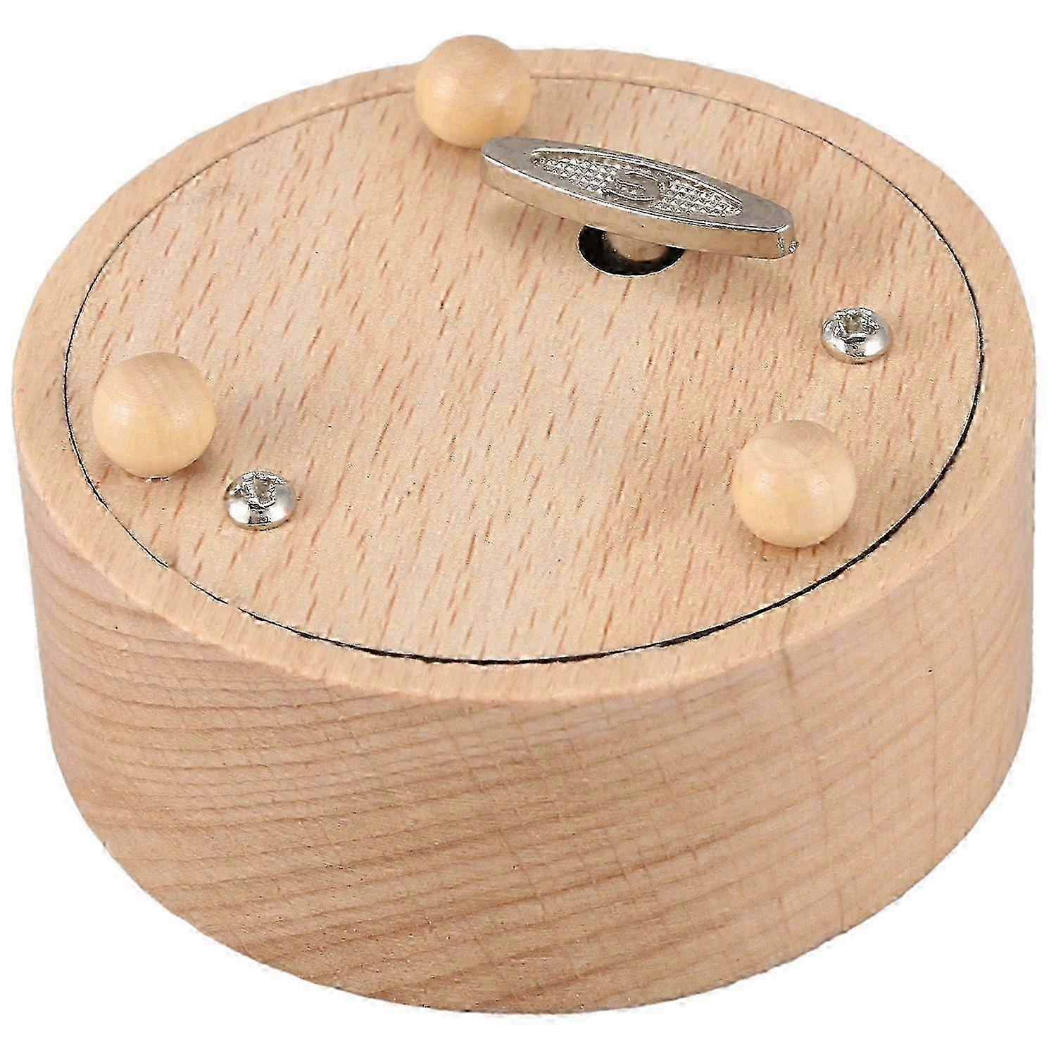 Miniature round blank music box model, without specified music.