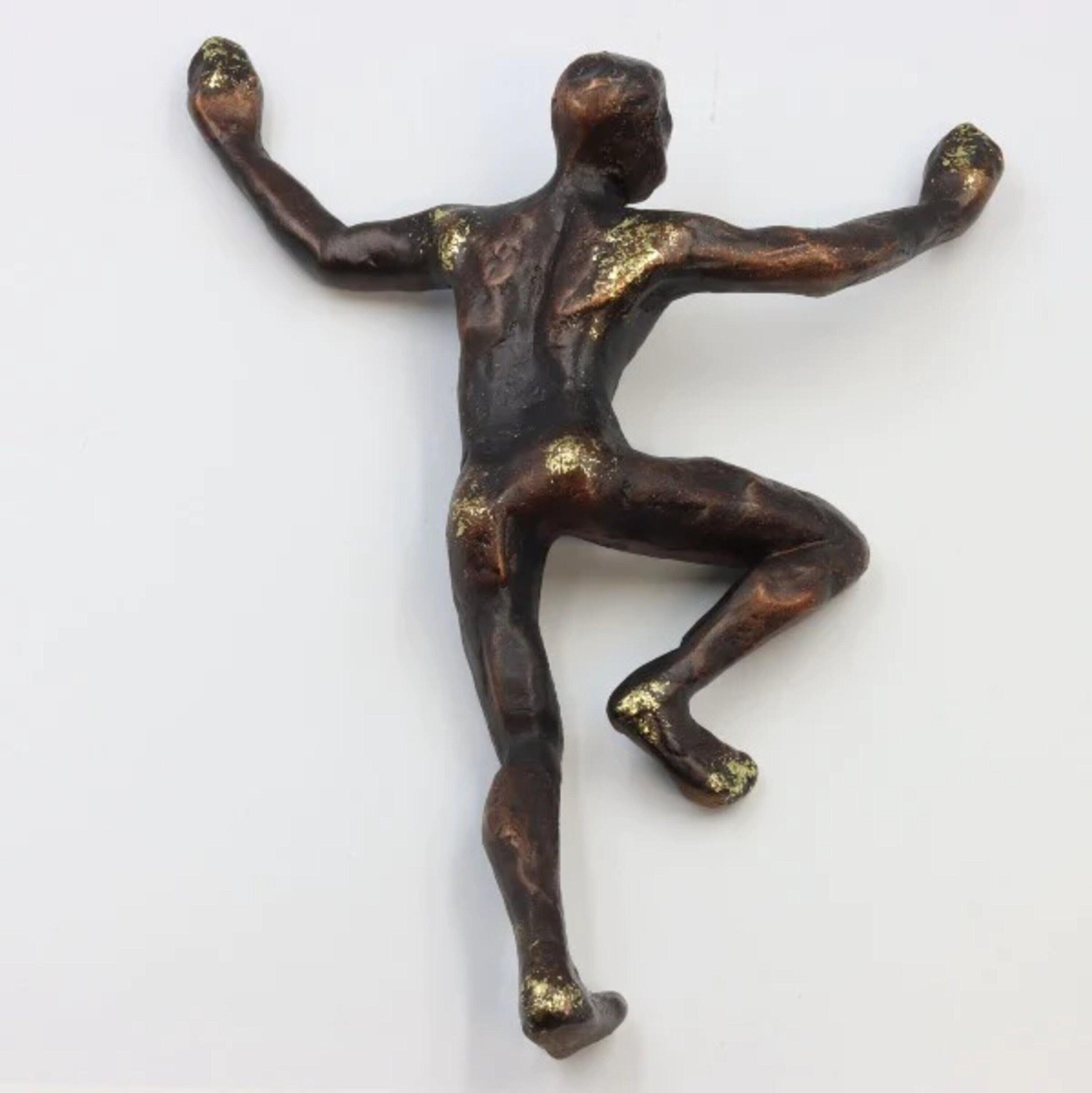 Cliff Facing Man Wall Sculpture