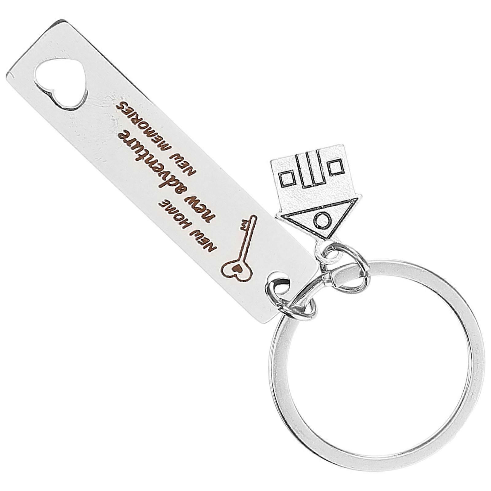 Here's a polished product description based on your input:
**Stainless Steel Housewarming Key Chain – Elegant House Charm with Engraved Bar –