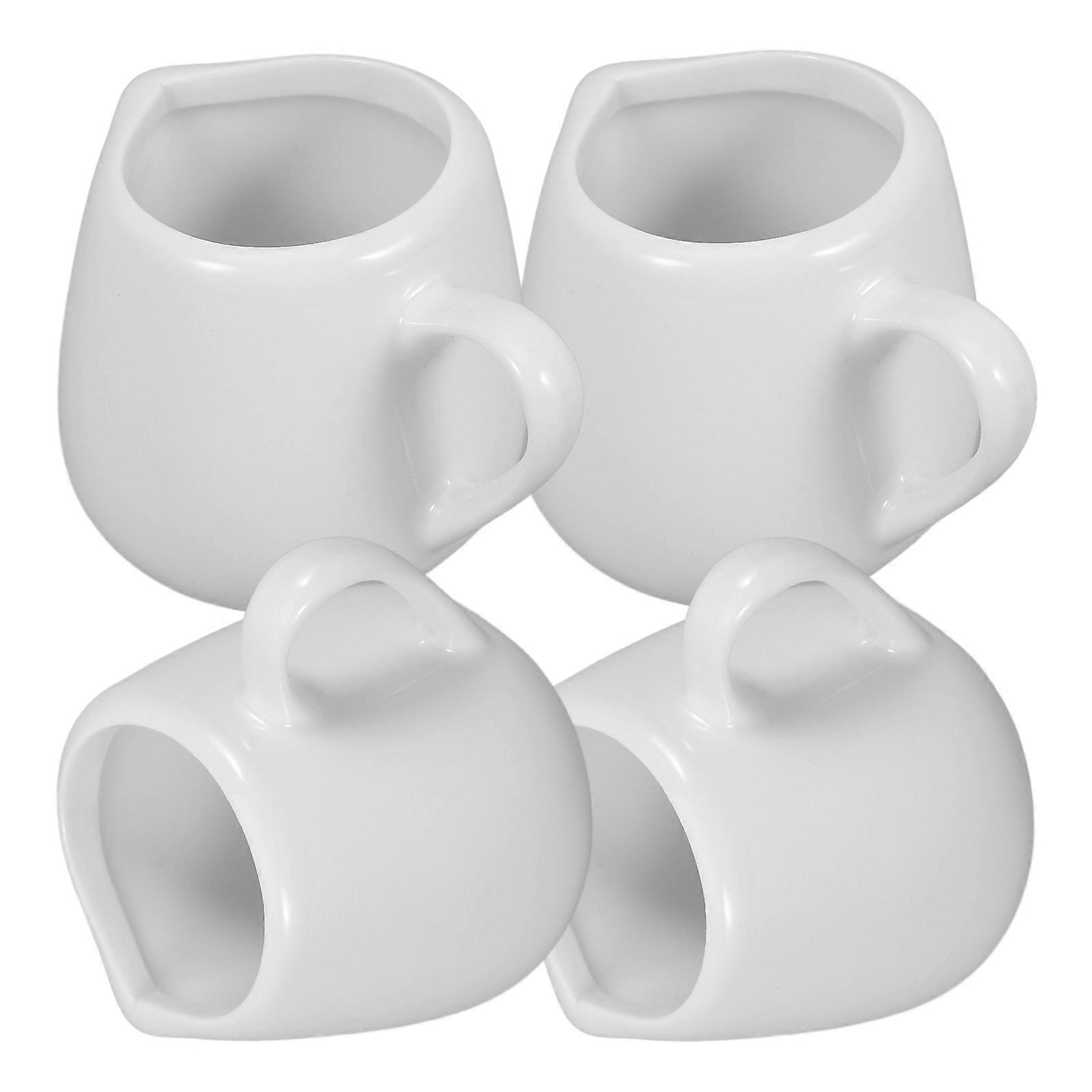 فيما يلي وصف مكرر واحترافي للمنتج ** 4 قطع أباريق حليب سيراميك صغيرة **:

### ** 4 عبوات أباريق حليب سيراميك صغيرة مع مقبض ،