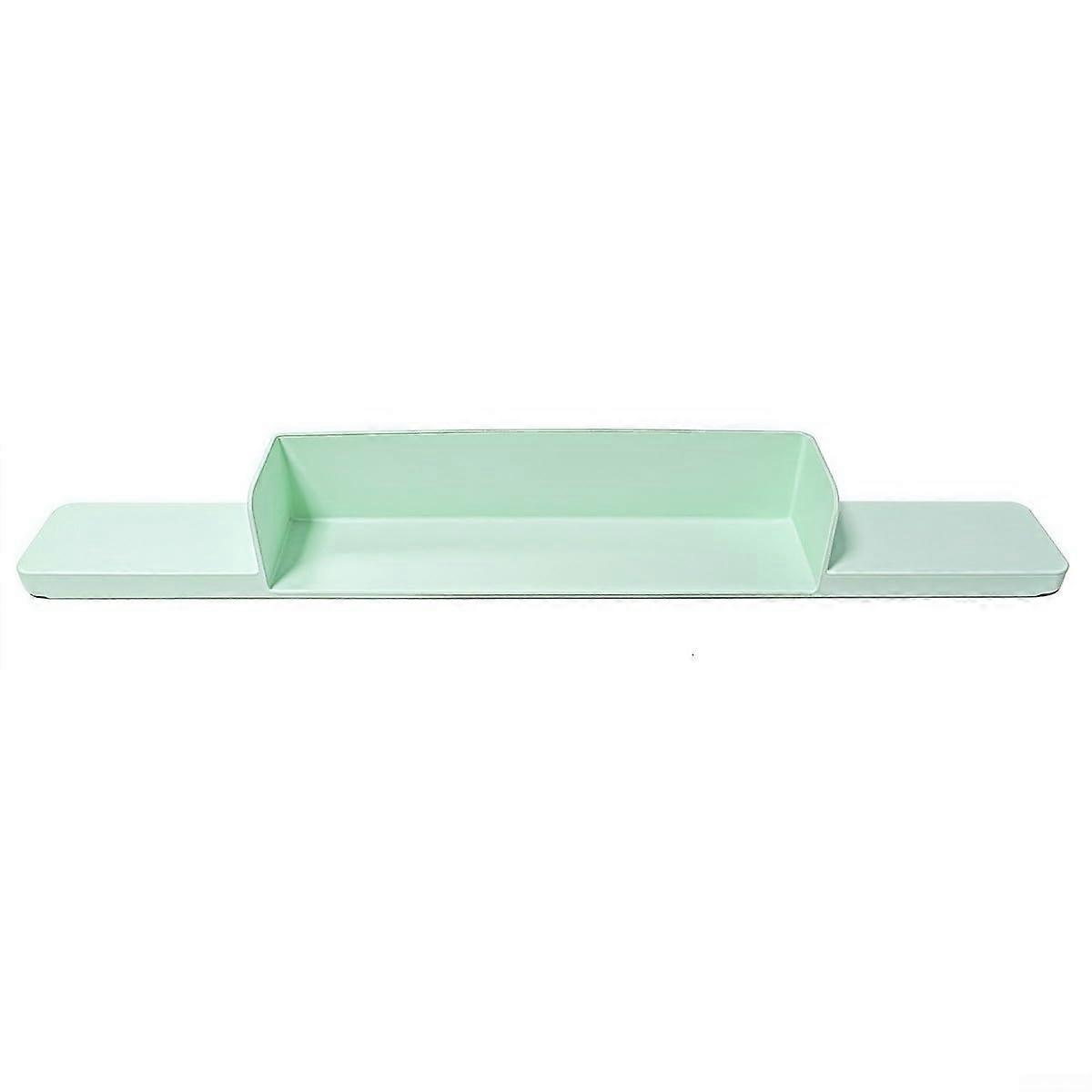 The easily removable silicone splash guard offers flexibility in various home environments (green).
