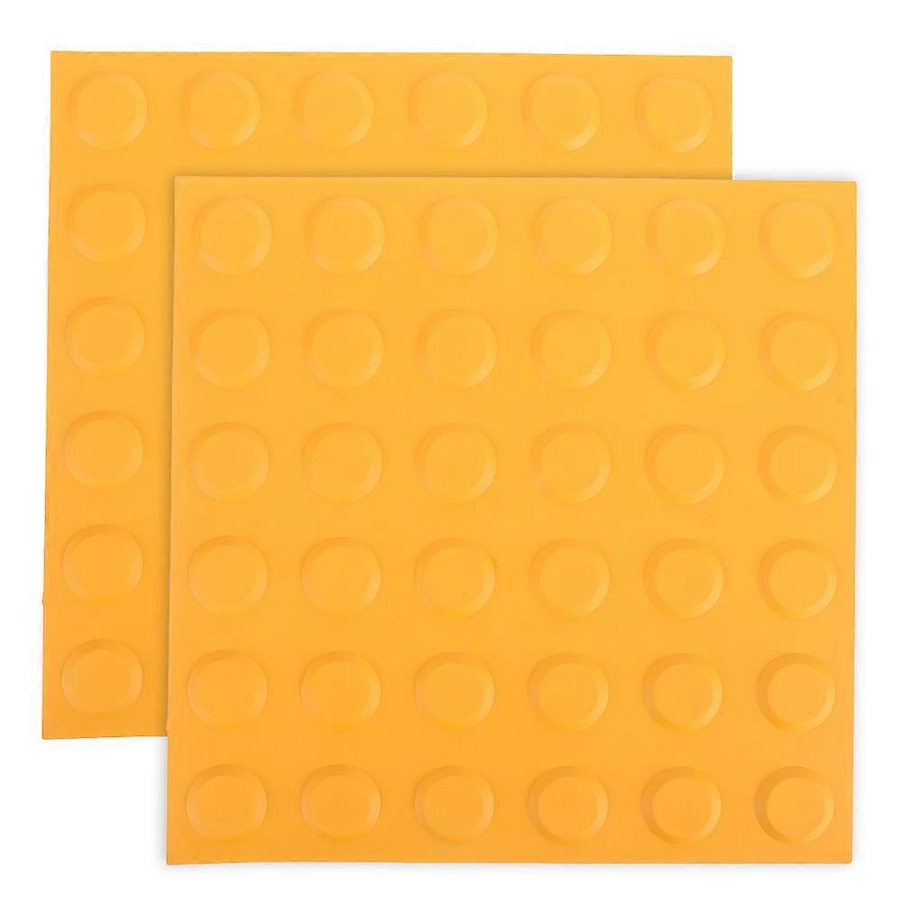 It seems you're referring to **tactile paving tiles**, specifically **sensory blind tiles** with **raised dots** (often called **blister tiles**) in