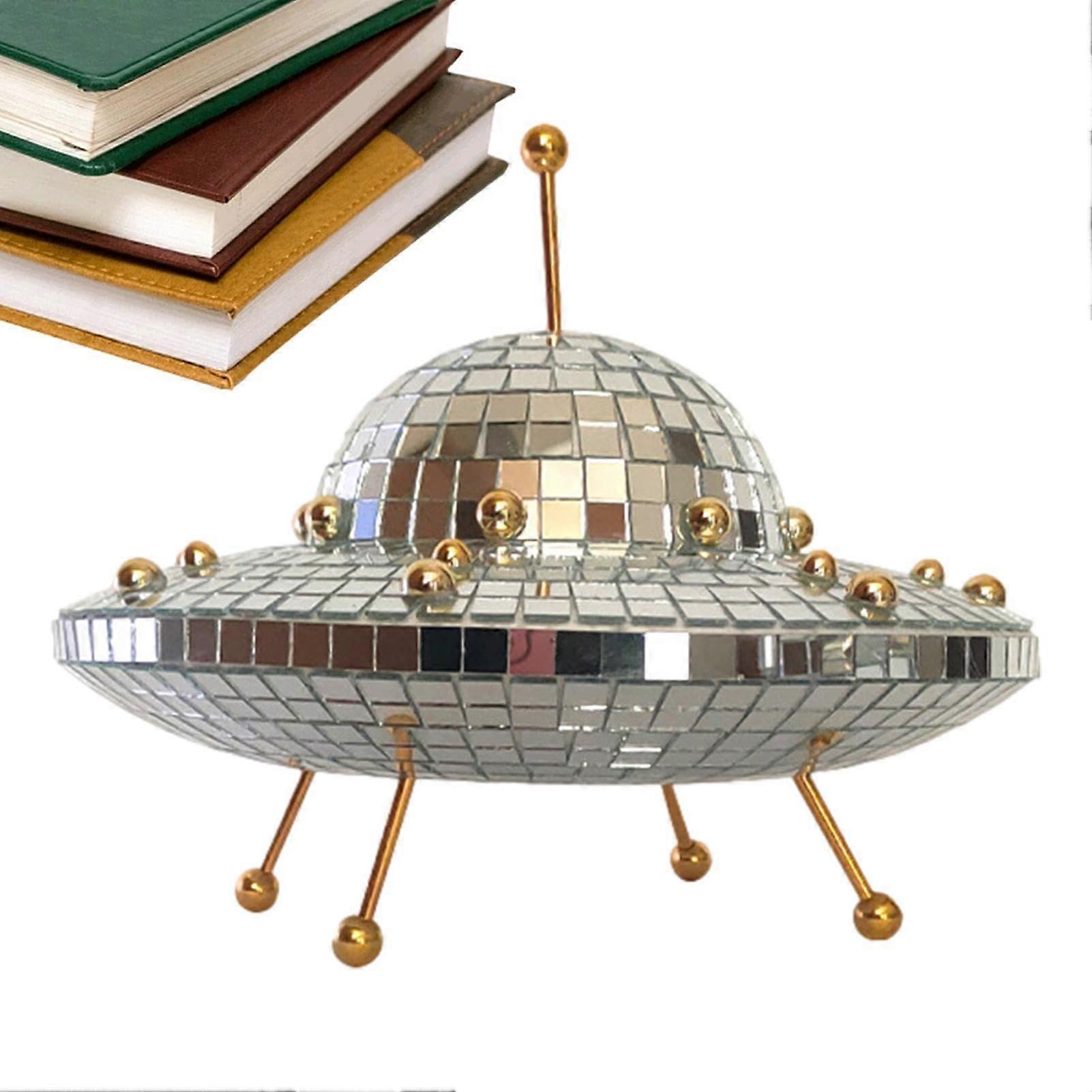 Flying Saucer Disco Ball Decoration The UFOshaped disco ball creates unique reflections when light hits the mirror.