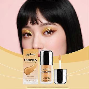 Sombra líquida dourada com glitter Zephoco. A sombra fina e brilhante não borra. Ideal para maquiagem diária dos olhos.