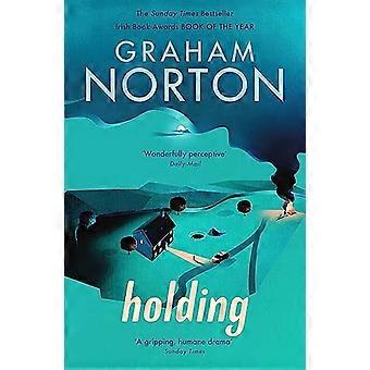 Holding The Sunday Times Bestseller AS SEEN ON ITV