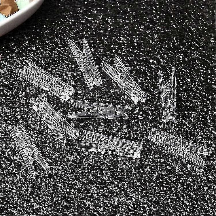 100pcs Mini clips colgantes de plástico transparente