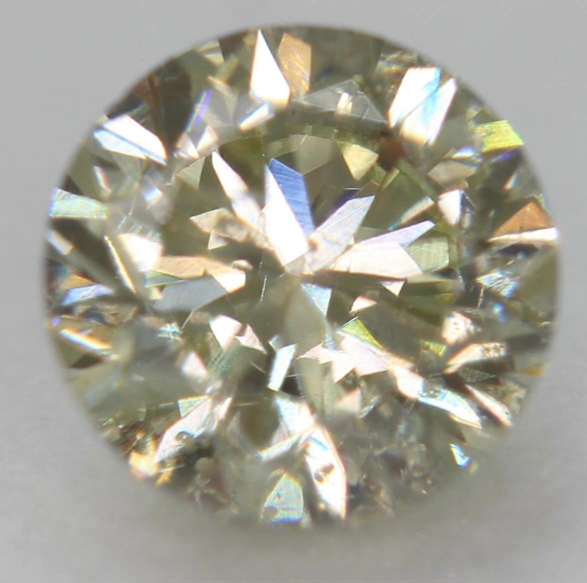 Cert 0.62 Carat Fancy Yellow VS2 Round Brilliant Natural Enhanced Diamond 5.25mm