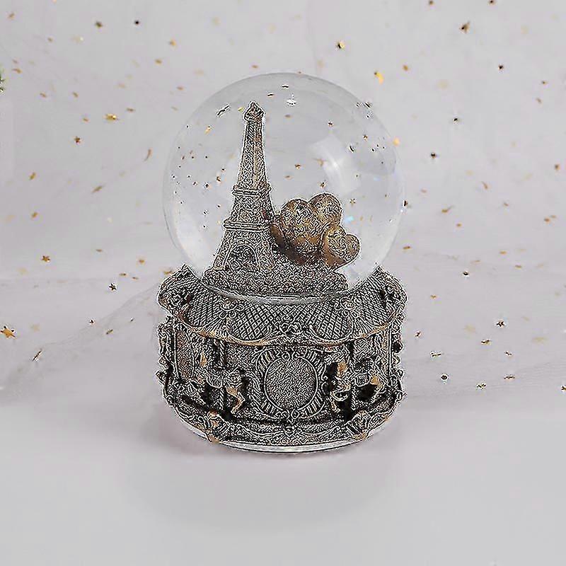 Boule à neige musicale Tour Eiffel de Paris avec neige artificielle et lumières colorées, 100 mm de hauteur.