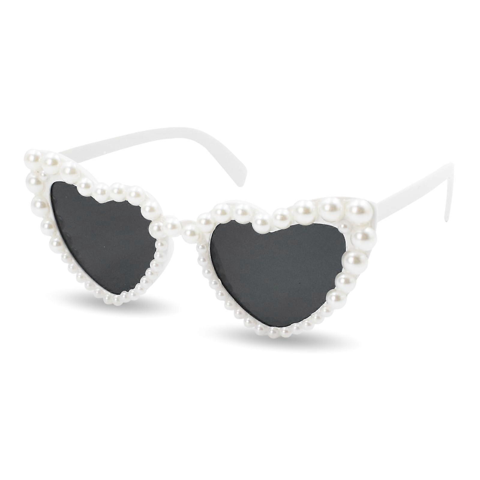 Heartshaped frame sunglasses adorned with pearls, in a white hue. A cool accessory for summer beach parties, discos, and music festivals.