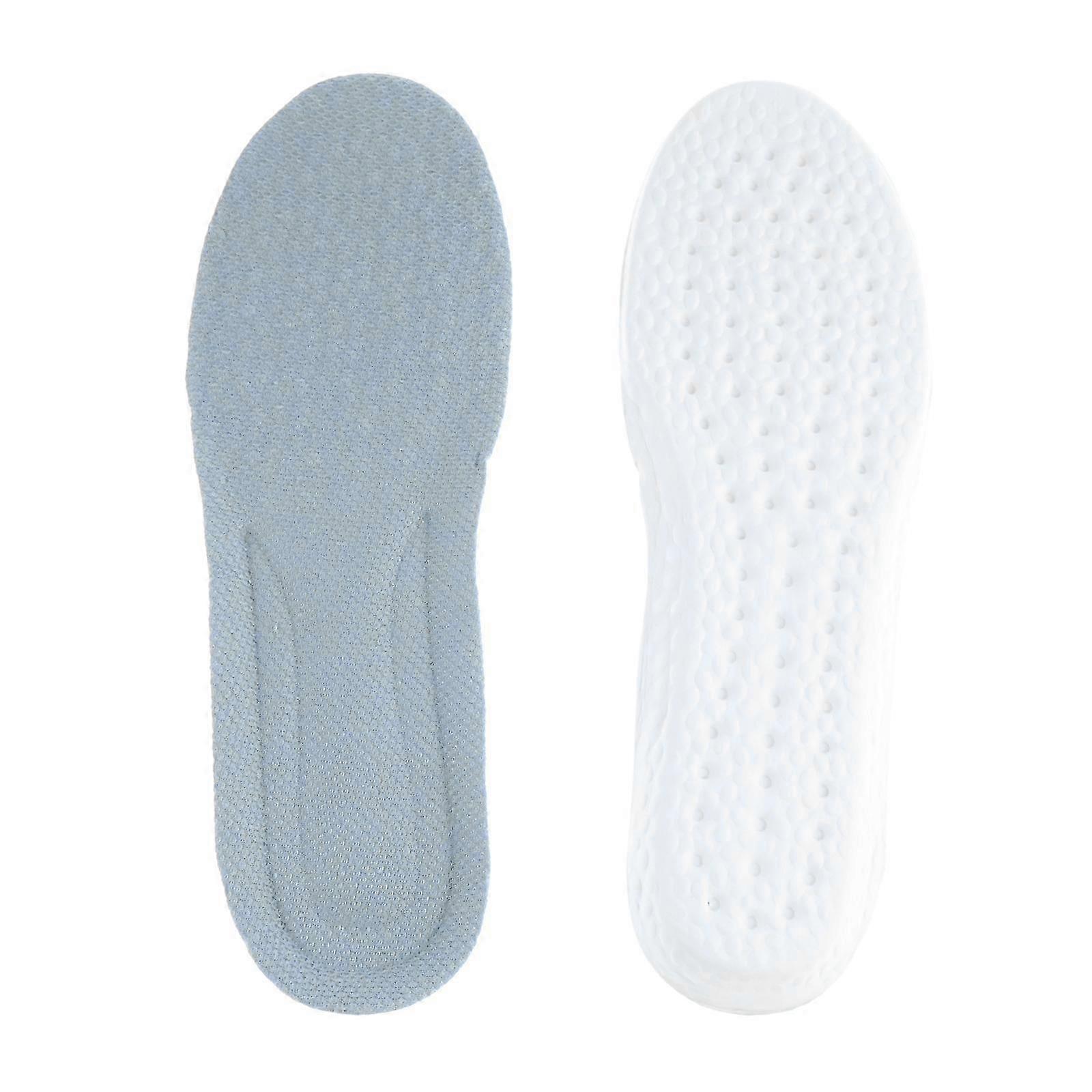 A pair of gray foam insoles with a white background