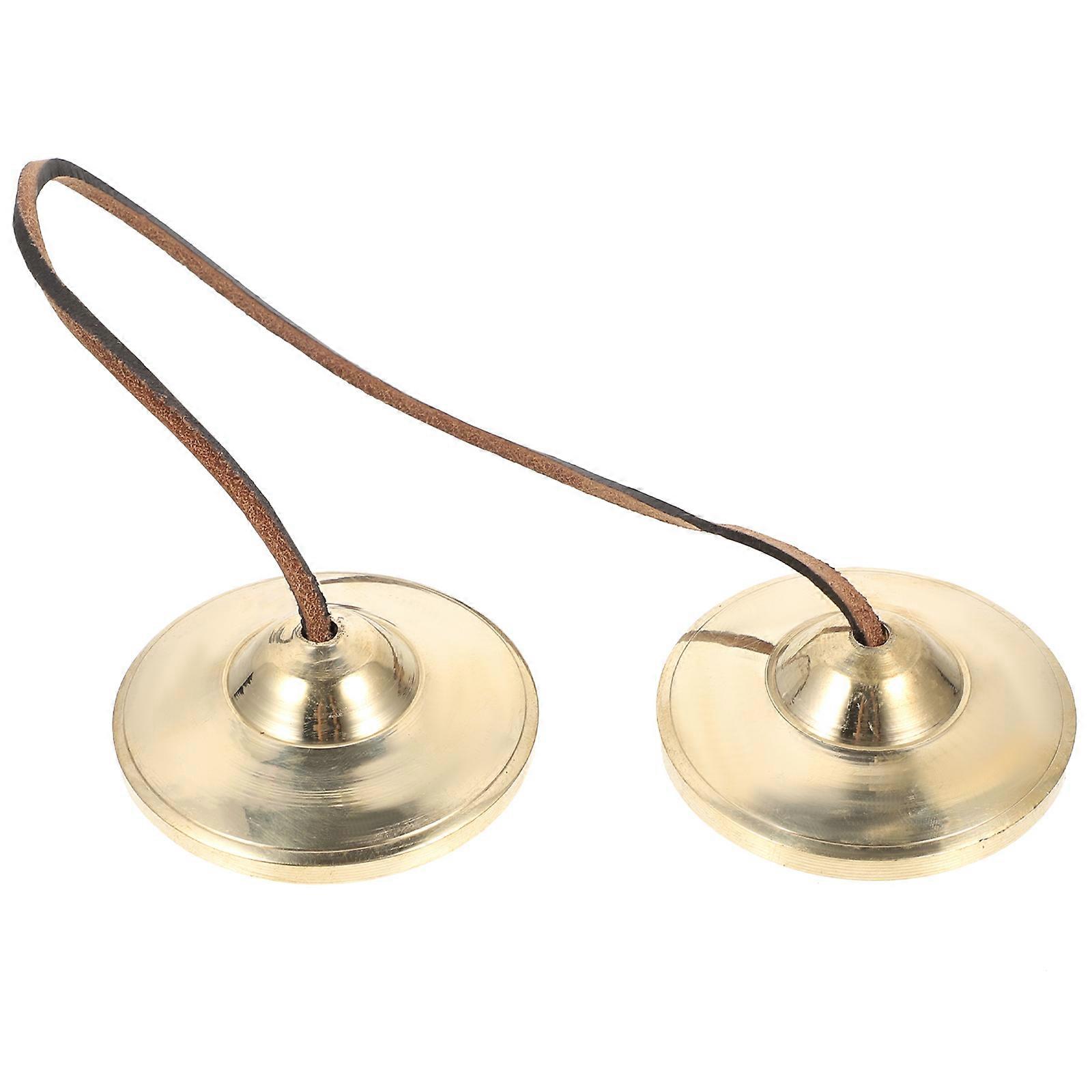 The **Vintage Copper Cymbal Bell Traditional Handbell** is a beautifully crafted percussion instrument that blends functionality with aesthetic