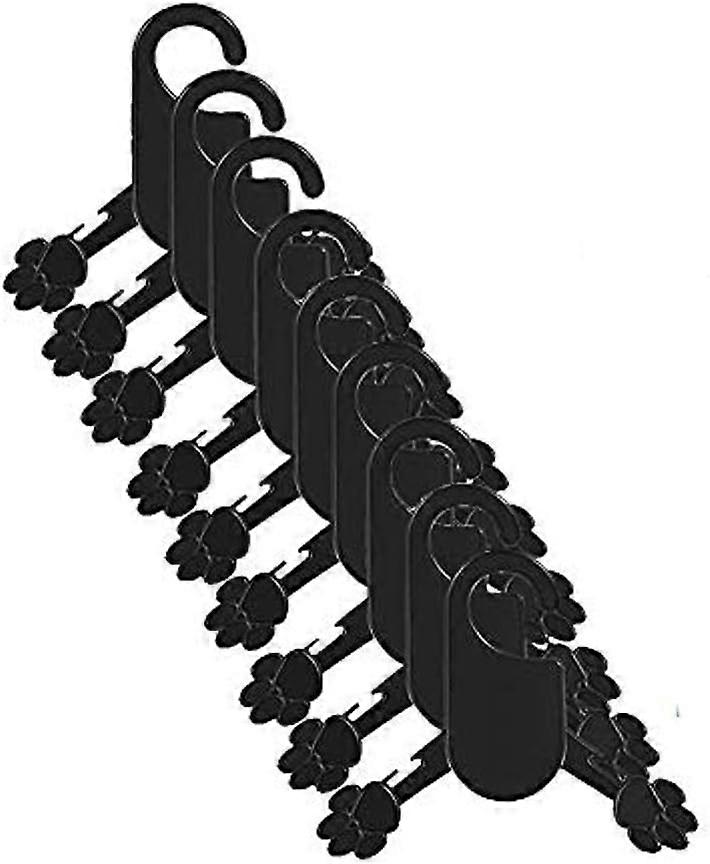 percha de plástico negro para cachorros de perro