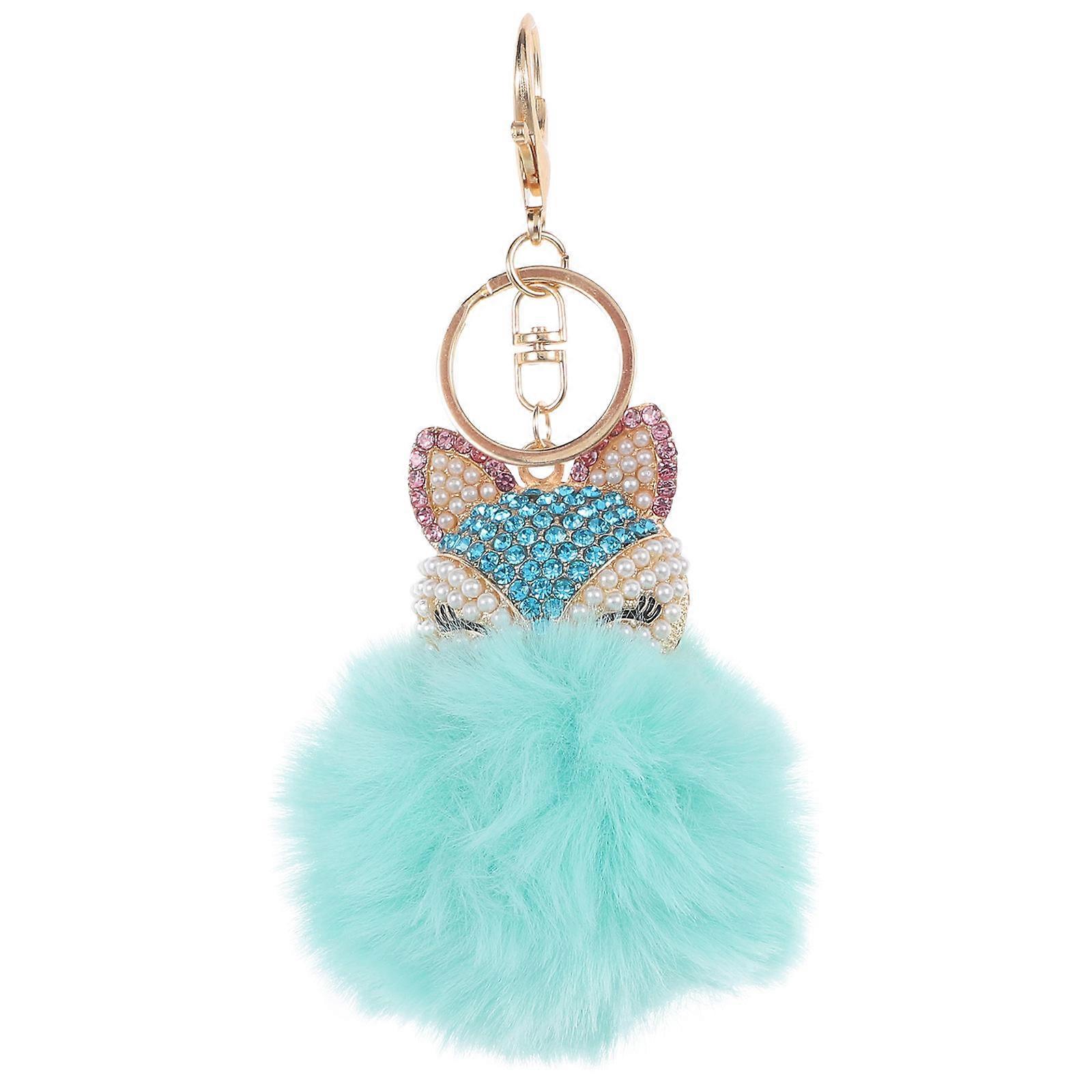 Chaveiro de bola fofa com pérolas e strass para celular.