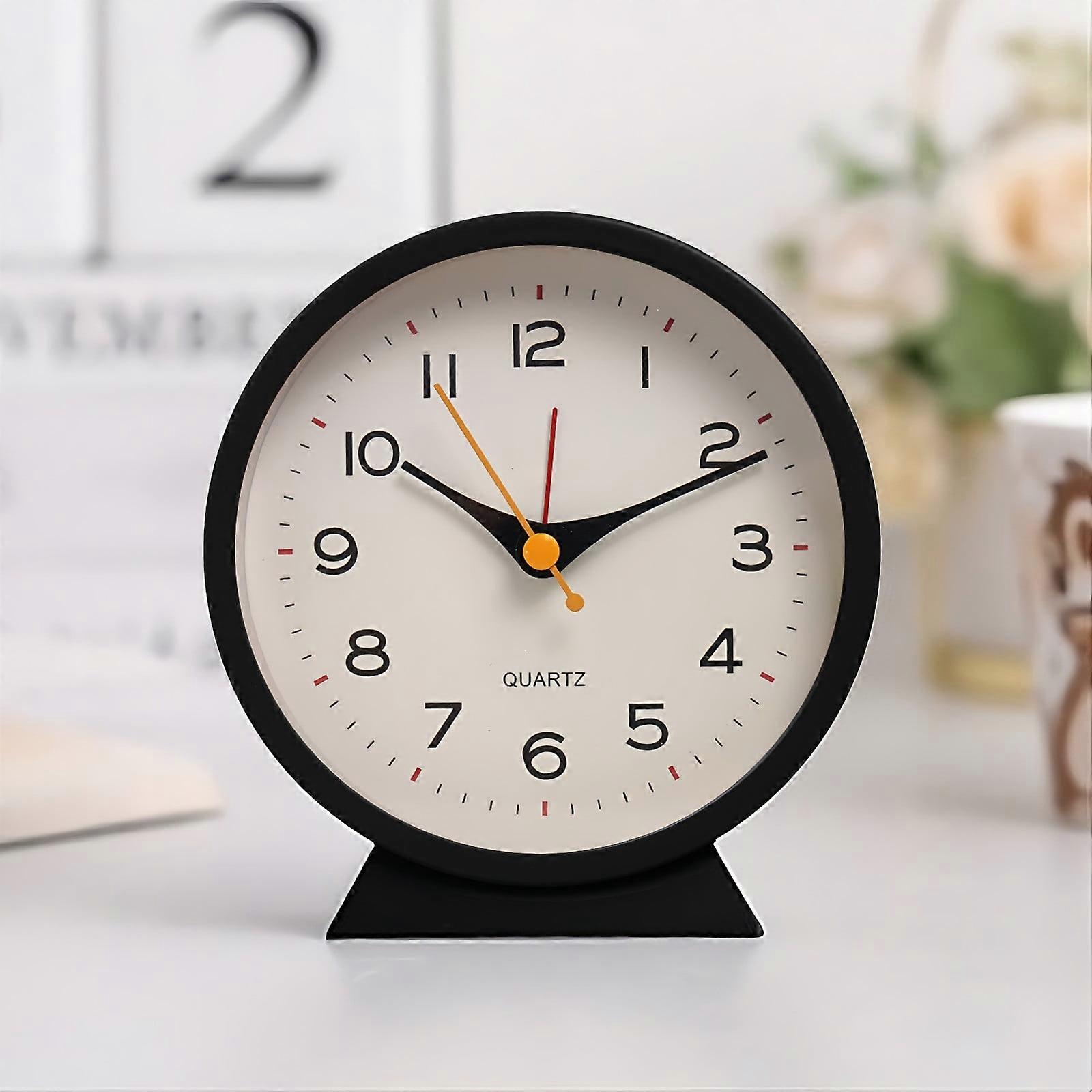 Daiosportswear Small Battery Powered Analog Alarm Clock Lights Up On Demand with Silent No Ticking Sound