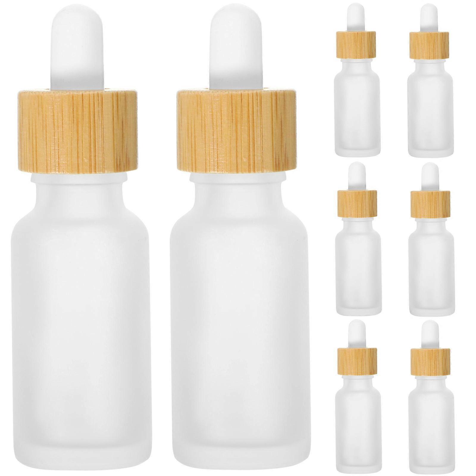 a polished and professional product description based on your input:

 

**8pcs Frosted Dropper Bottles with Bamboo Wood Ring – Refillable Essential