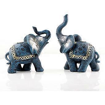 青いタイのカップルの象の置物の彫像のトランクの上の