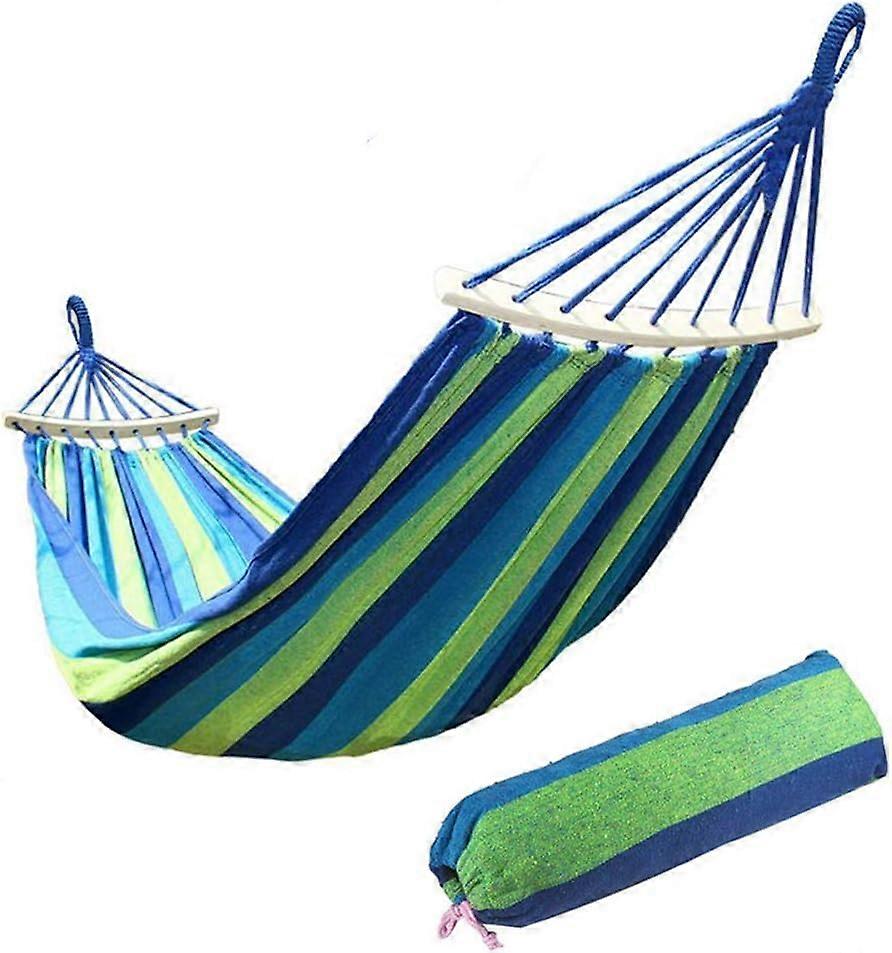 Breathable canvas hammock with wooden rods and carrying bag, for garden, terrace, and outdoor relaxation.