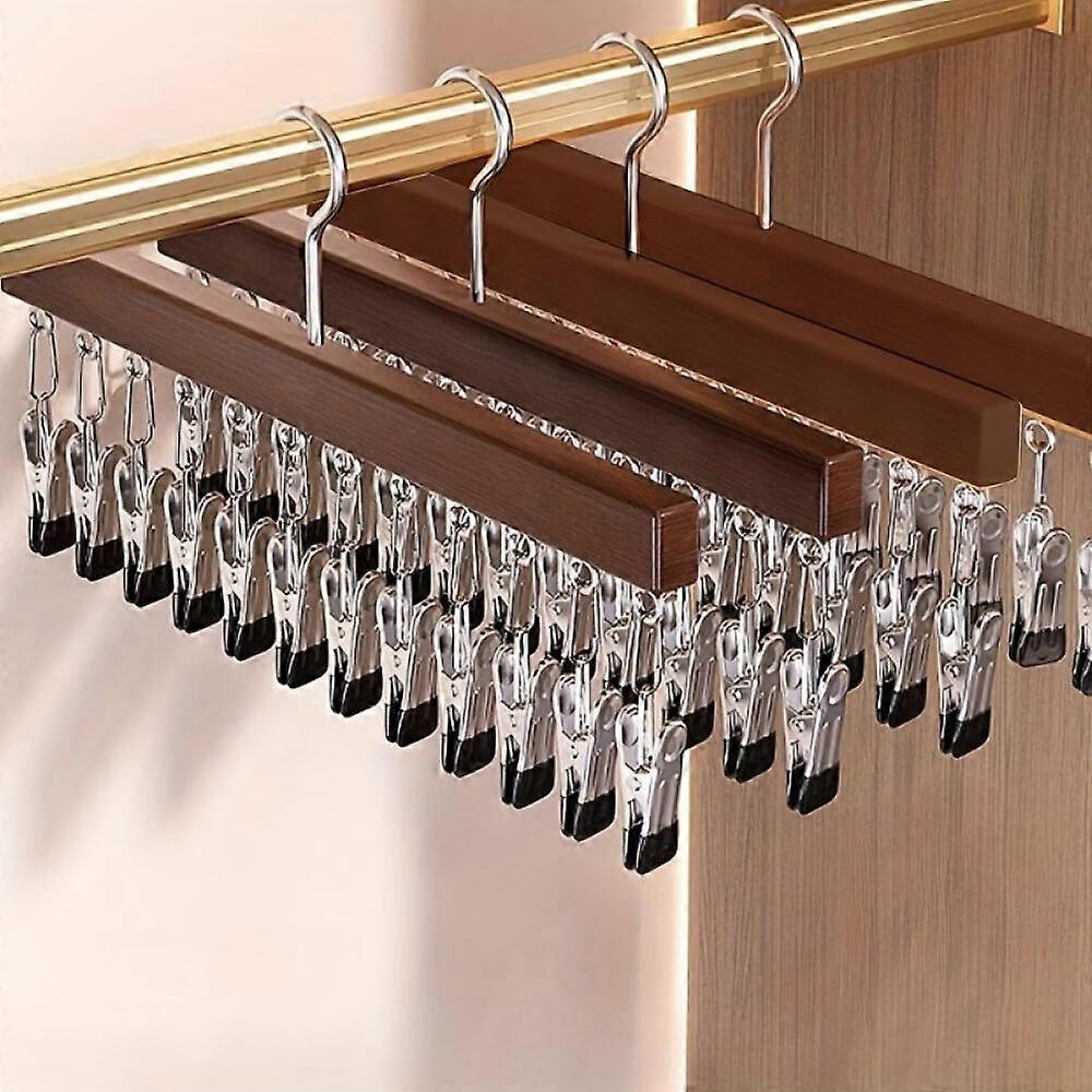 This 4-piece set of clothes hooks with clips saves space and is ideal for storing shorts, jeans, hats, and socks, making it perfect for your wardrobe.