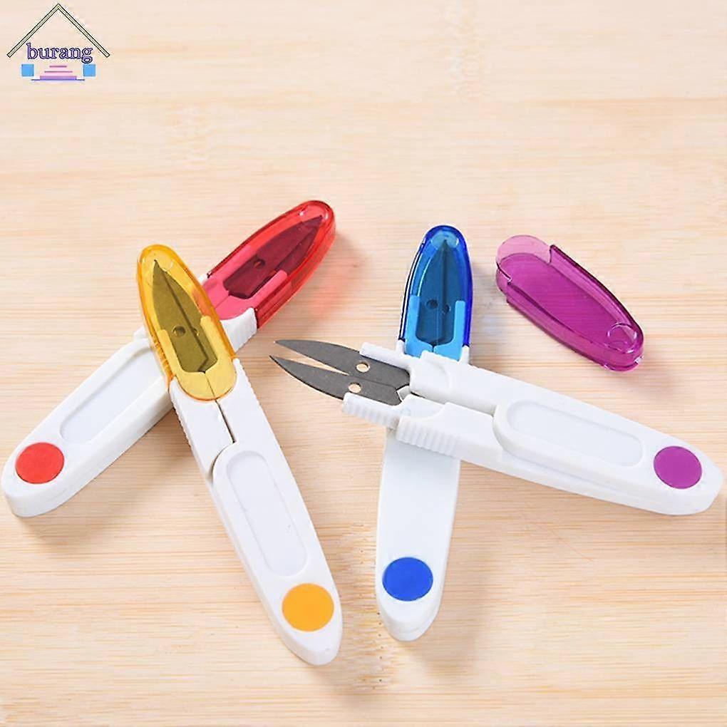 Cross-stitch scissors, craft thread cutters, plastic handles, sewing thread, embroidery scissors, random colors.