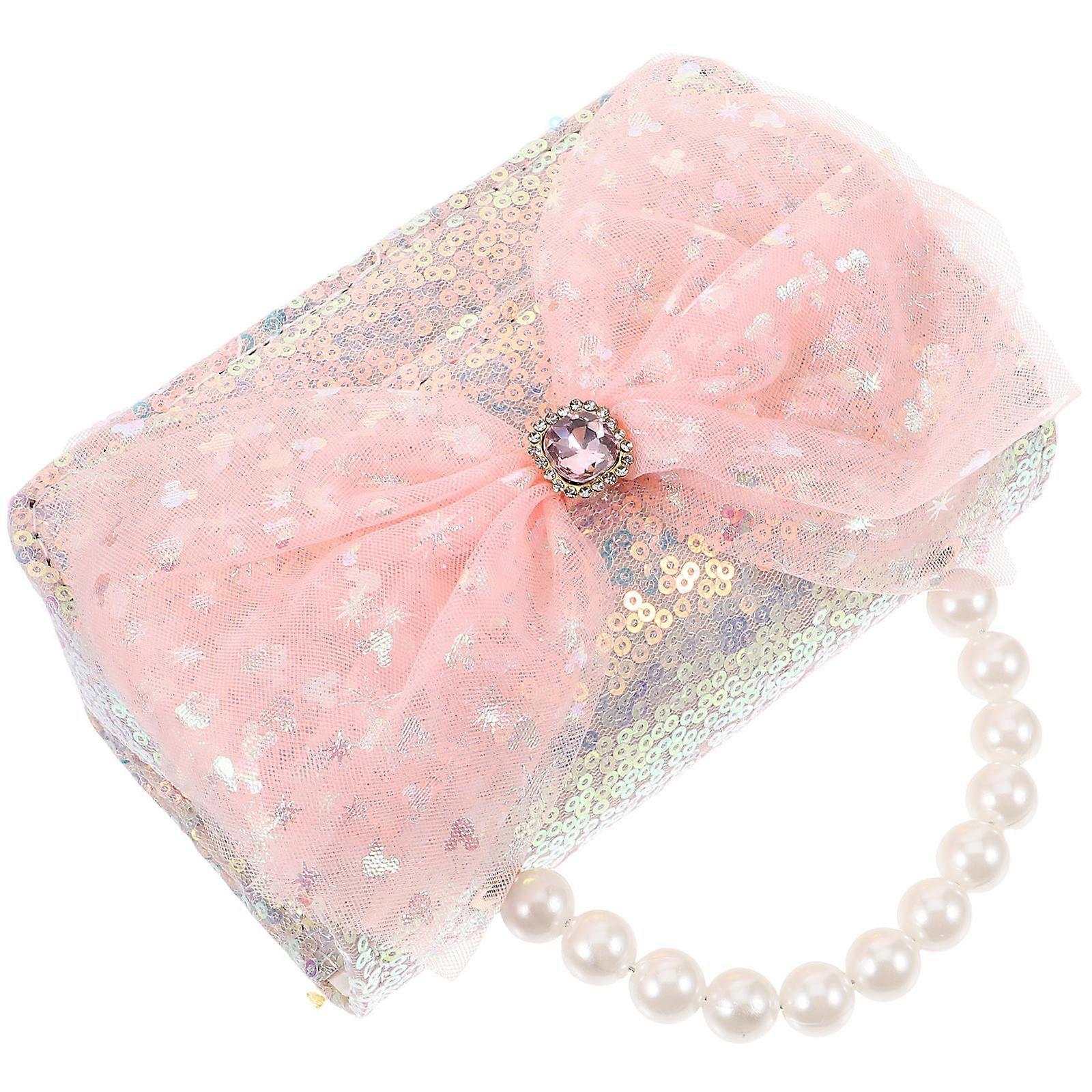 Elegant Travel Handbag Featuring a Stylish Bow and Adjustable Strap