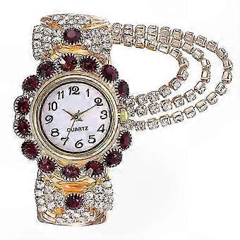 Secure adjustable fit & rhinestone flower bezel enhance this women's gold quartz watch with crystal dial, metal bracelet, for weddings or daily wear