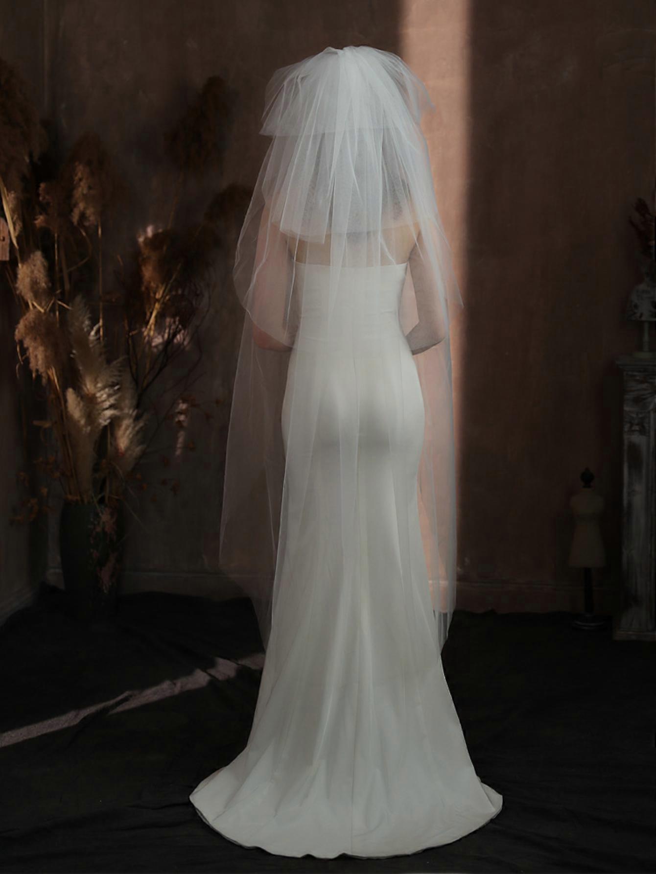Multi-layered voluminous bridal veil, white, long, simple design for wedding looks