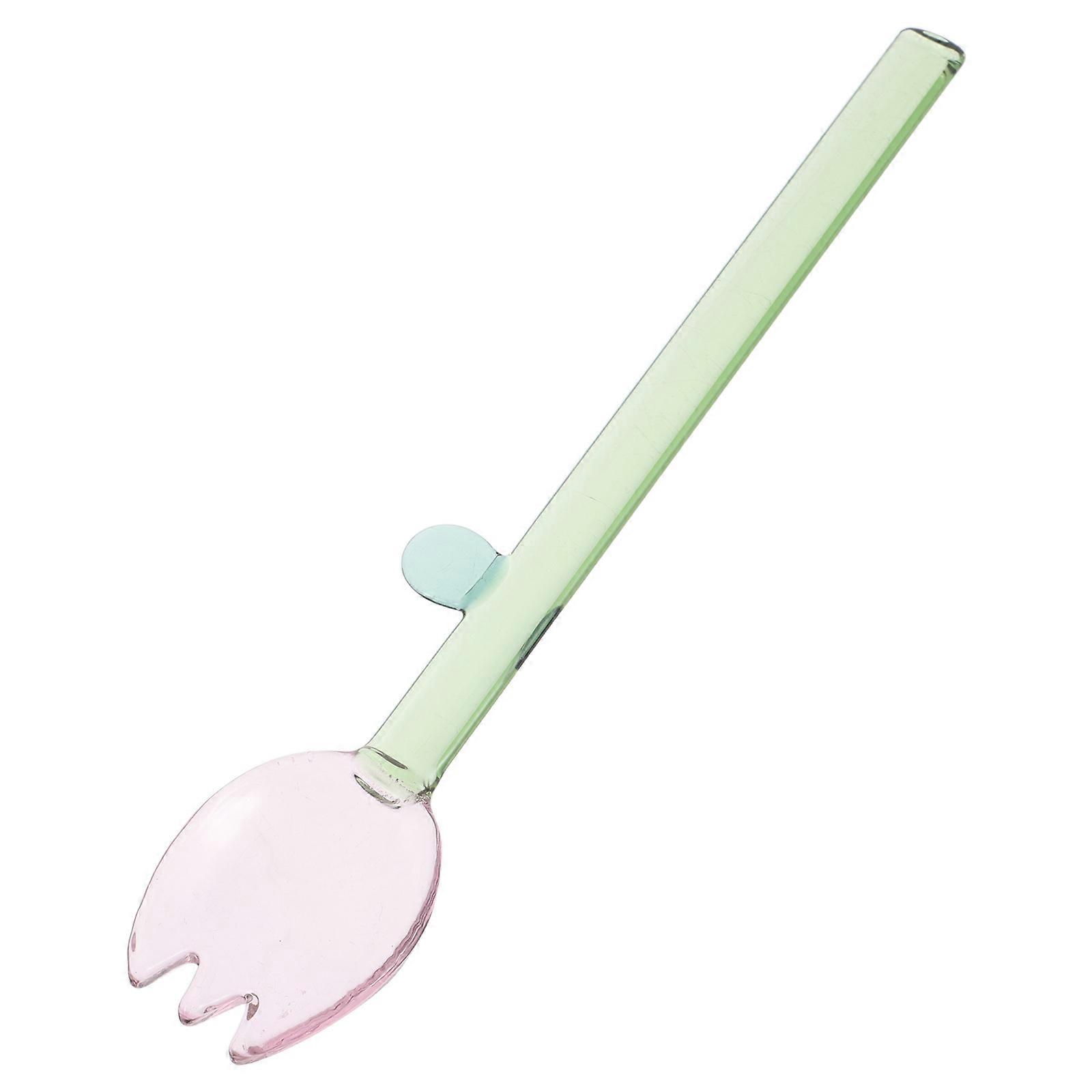 It sounds like you're describing a **long handle glass spoon with a charming flower design**, perfect for use with **ice cream, pudding, and