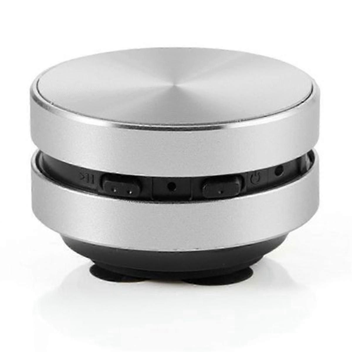 A portable, silver, compatible bone conduction Bluetooth speaker with stereo sound.